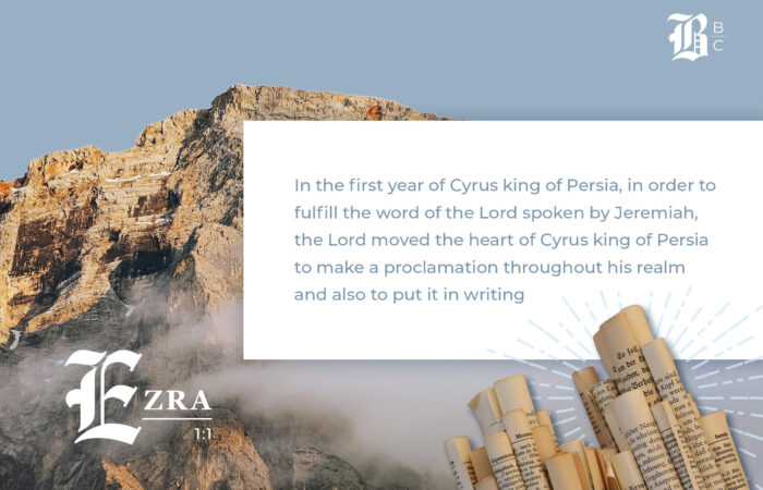 Torn paper revealing Bible verse from Ezra 1 about God stirring hearts.